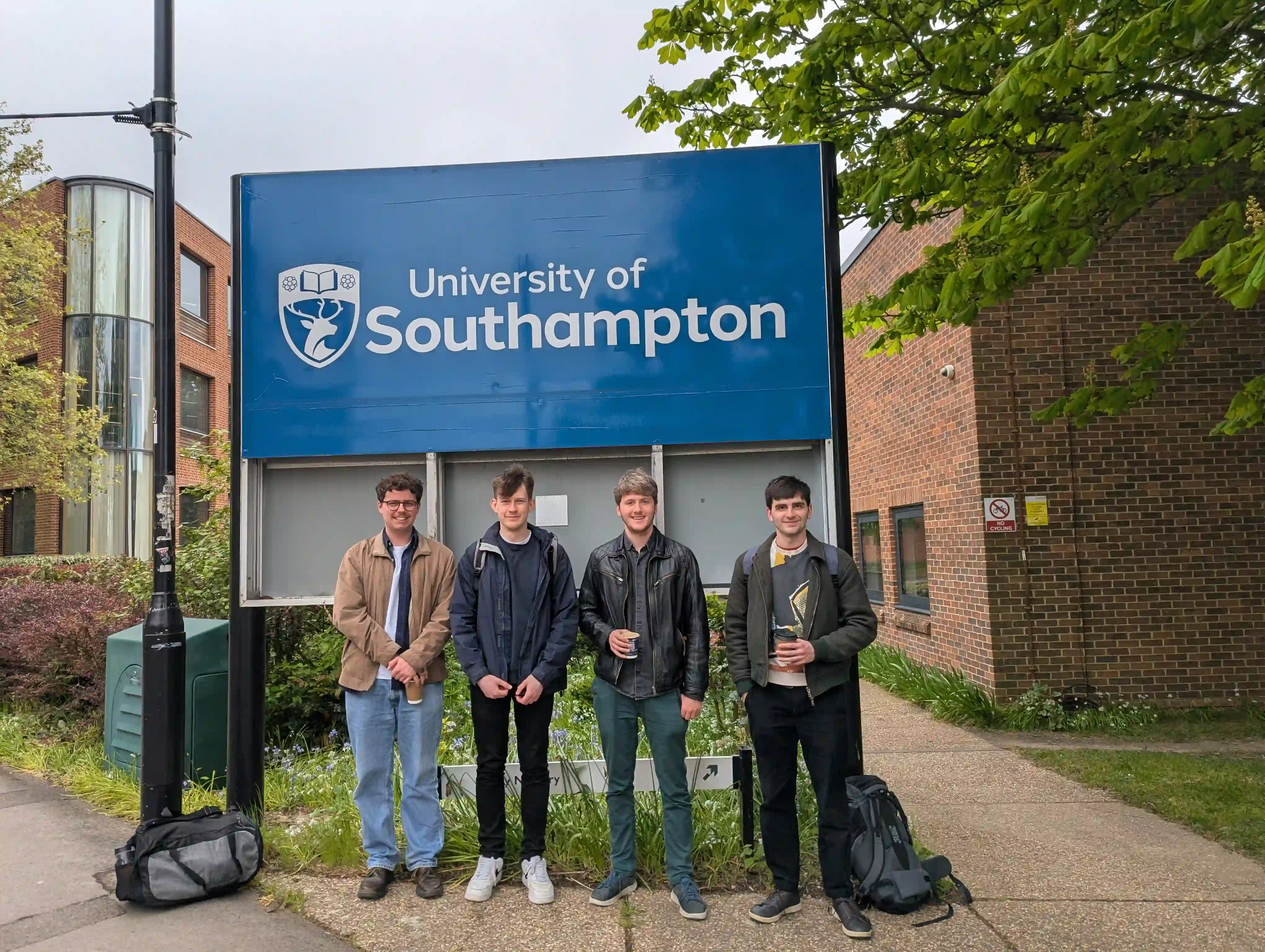 Orry, Cameron, Liam, and Ross in front of a University of Southampton sign