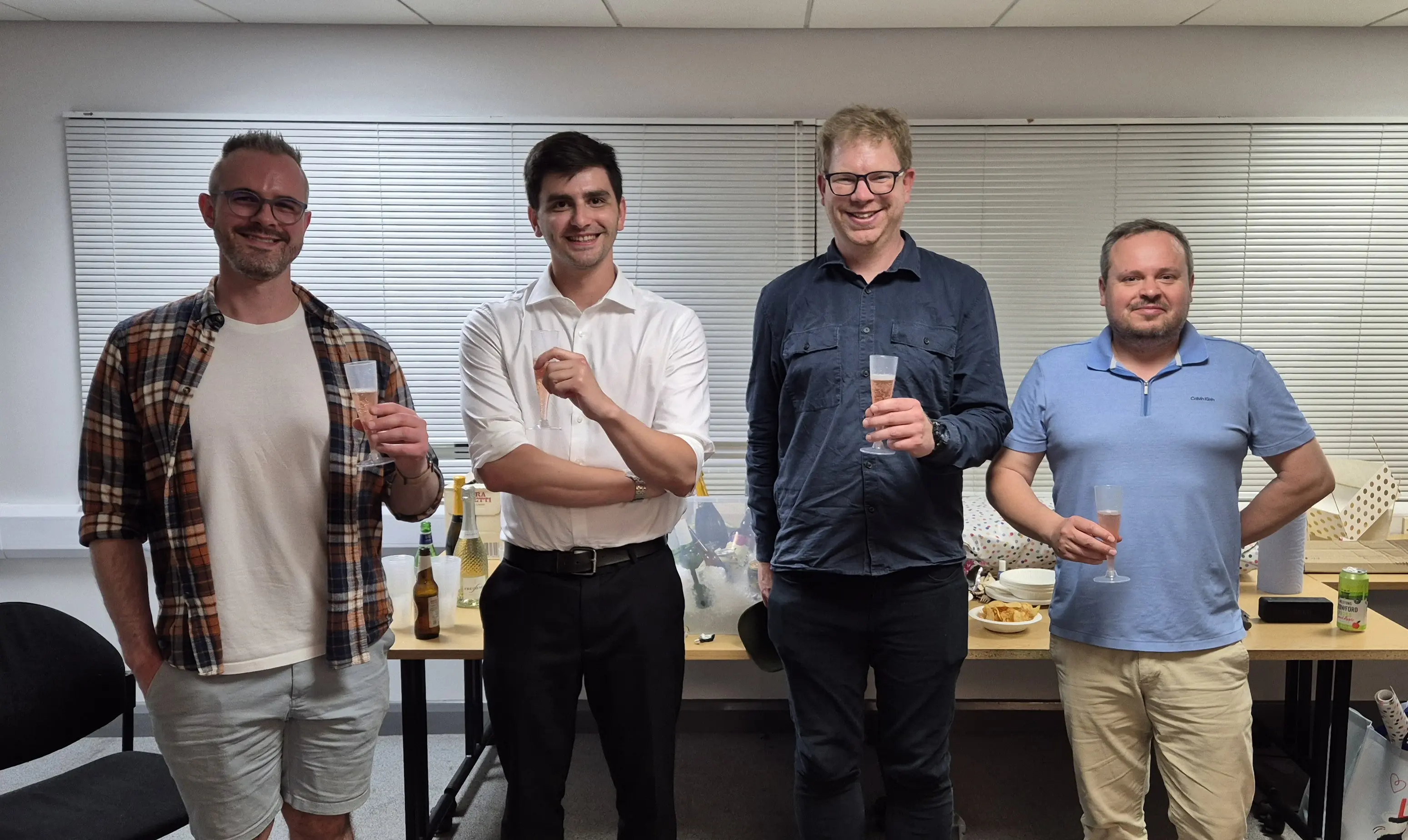 Conrad, Ross, Dave, and Greg toasting.